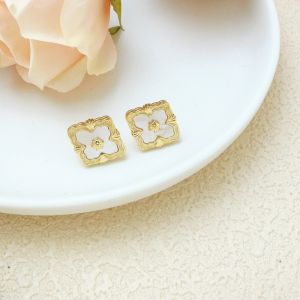 Delicate Earrings Studs with Gold Detailing in Cream EUR563